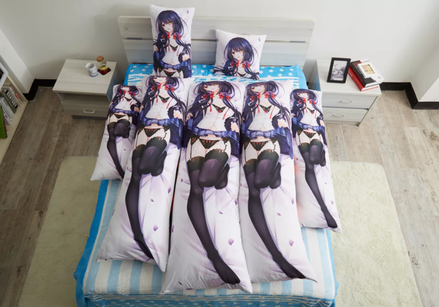 Dakimakura sizes arranged on a bed, from a small cushion to full length