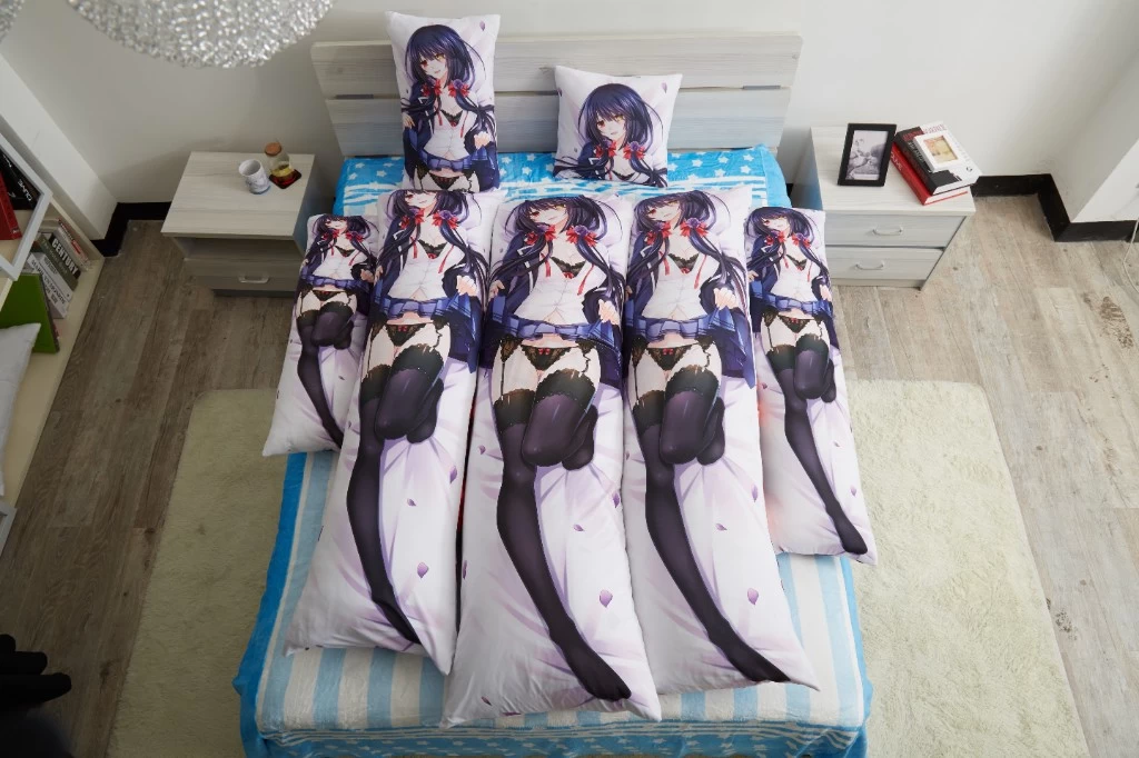 Dakimakura sizes arranged together on one bed, from compact pillows at the headboard to full-length body pillows side by side